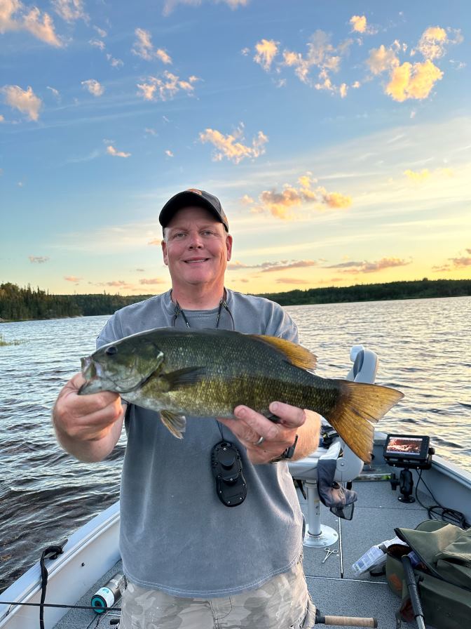 Don't get stuck cloud-watching out here, you'll miss beautiful prizes like this Smallmouth Bass!